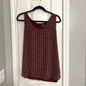 Sleeveless top with patterned design on front